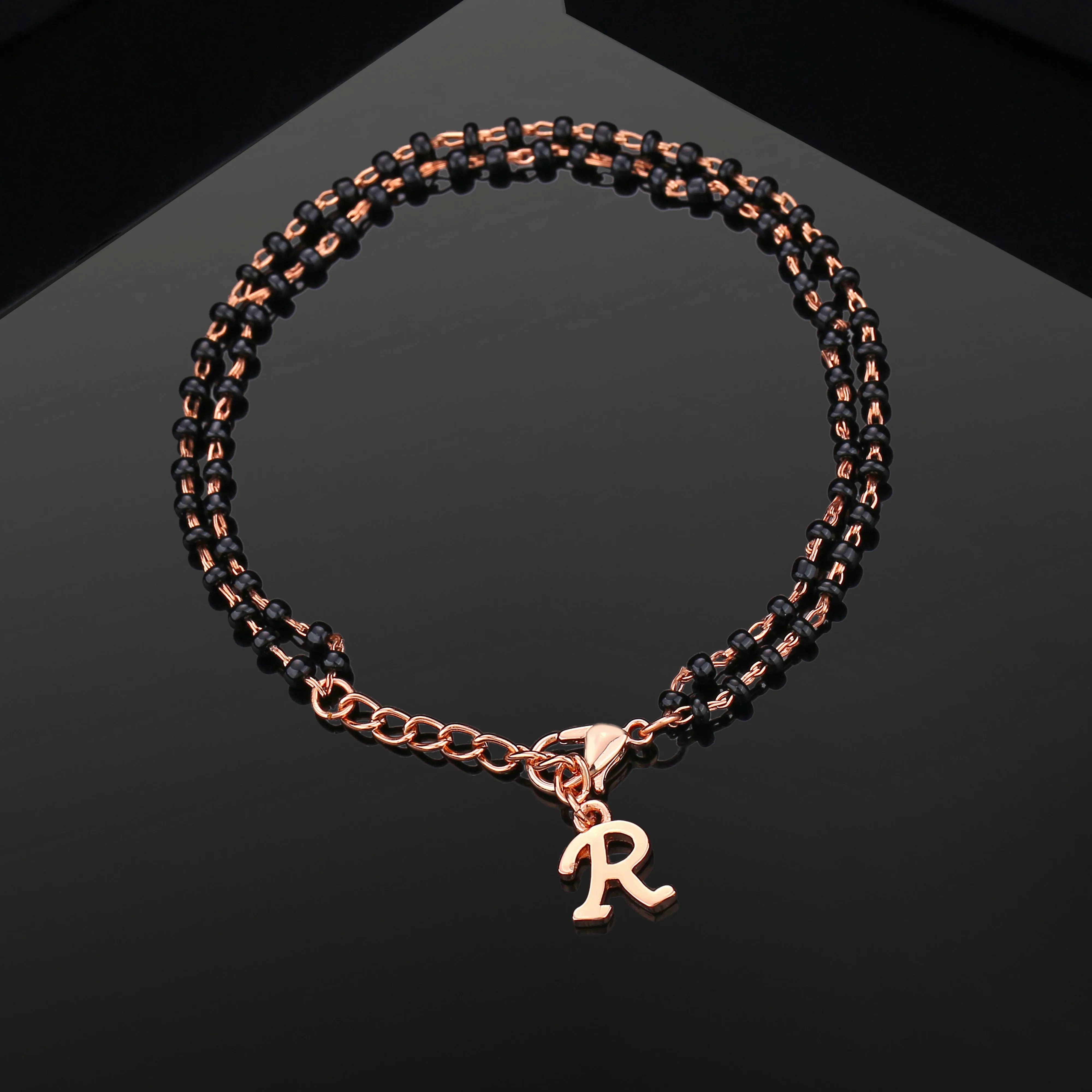 Estele Rose Gold Plated Personalized &quot;R&quot; Initial Mangalsutra Charm Bracelet with Black Beads for Women