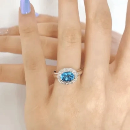 Oval Blue Topaz Ring with Diamonds