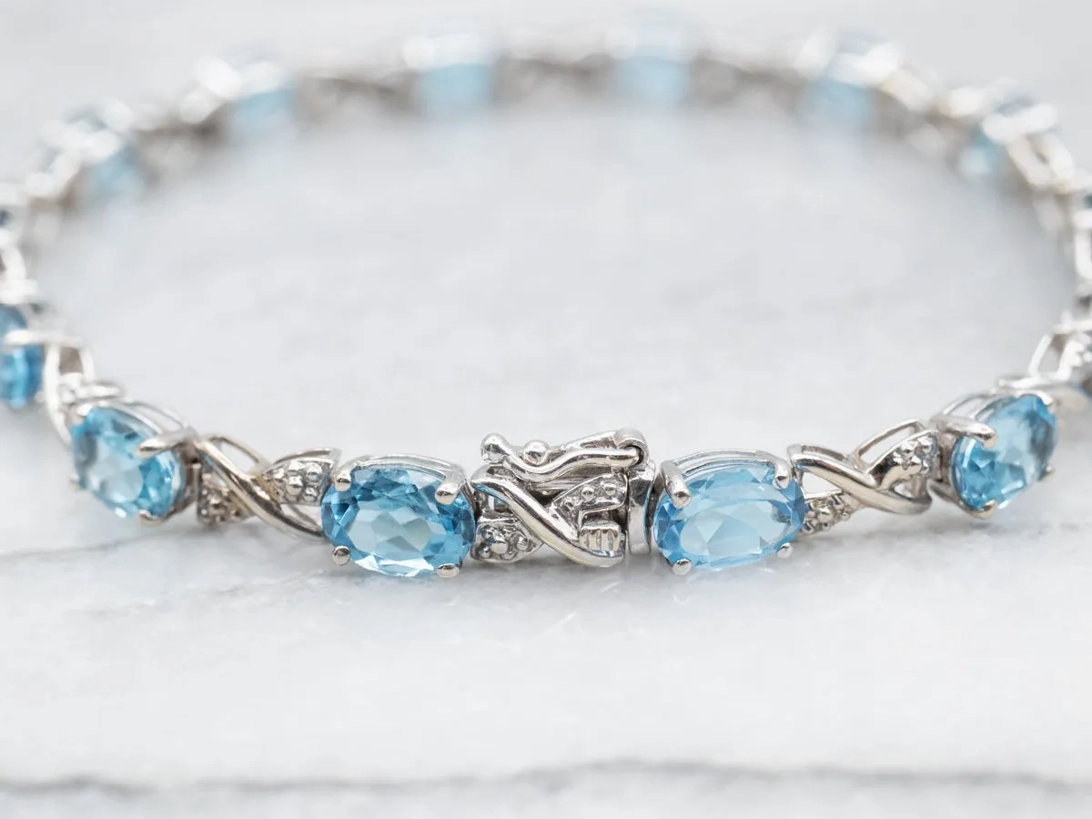 White Gold Blue Topaz X Link Tennis Bracelet with Diamond Accents